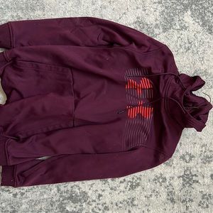 A maroon Under Armour Sweatshirt